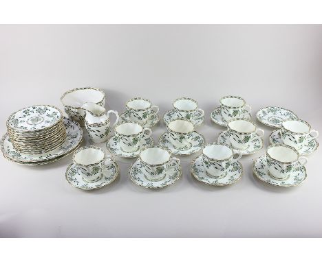 A Victorian porcelain part tea set, with green floral decoration and gilt embellishments on white ground, comprising eleven t