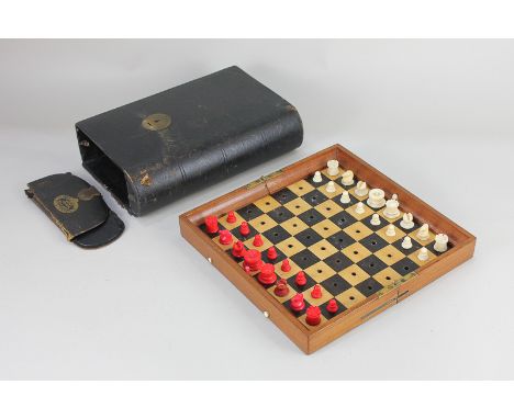 A Jaques &amp; Son Patentees 'In Statu Quo' travelling chess set, the folding mahogany case with chequered games board fitted
