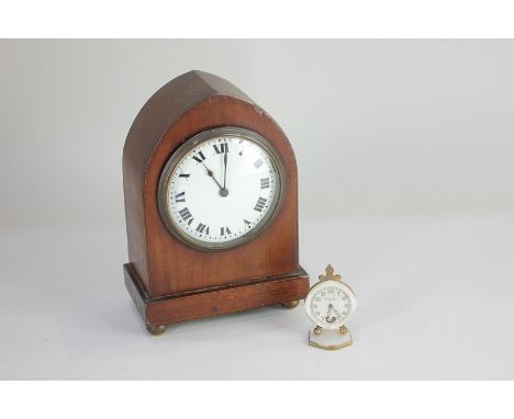 A gilt metal and mother of pearl miniature travel clock, the dial marked Fleur De Lys De Paris, 6.5cm high, together with a m