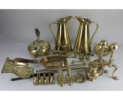 A large collection of brassware, including a pair of JS&amp;S jugs, pair fire dogs and matching tools, a kettle and other ite
