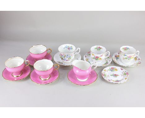 Two Royal Albert Crown china teacups and saucers and a small plate, of scalloped form with floral design, three Paragon porce