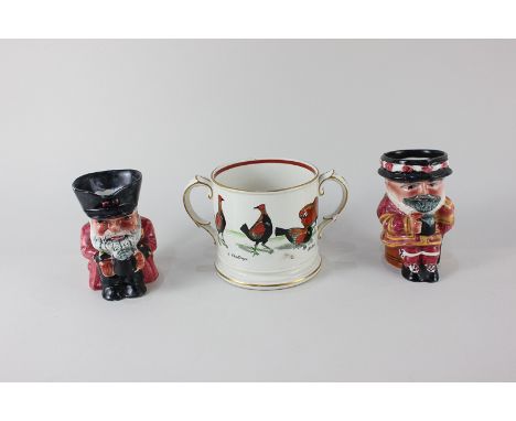An Ashworth Brothers Hanley porcelain two handled cup decorated with scenes of a cock fight, together with two Staffordshire 