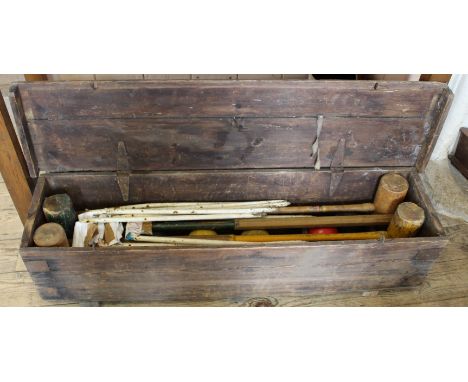 A vintage croquet set in a pine box