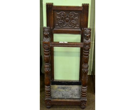 Early 20th century carved oak stick stand with lion head finials 