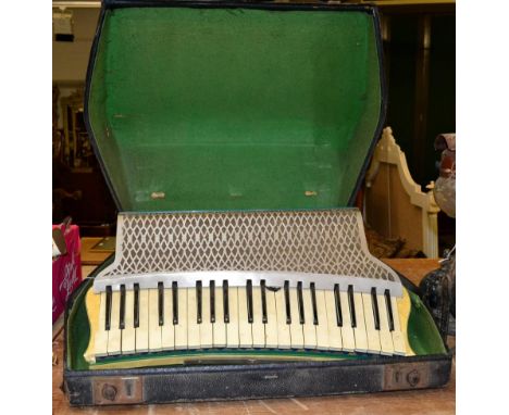 Accordion Hohner Organetta III, 120 bass buttons and 41 keys, has slider for two voices (cased).  All buttons appear to work,