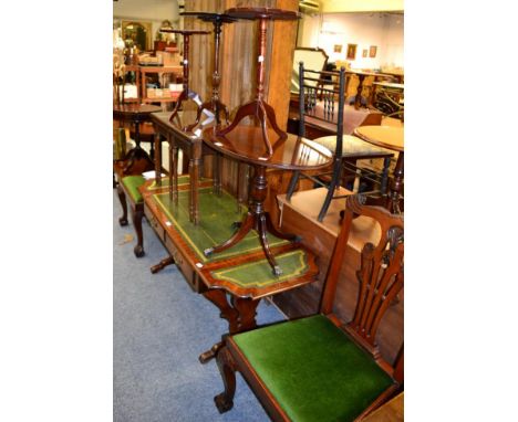 Small group of reproduction furniture comprising a pair of Chippendale style dining chairs; three mahogany wine tables; nest 