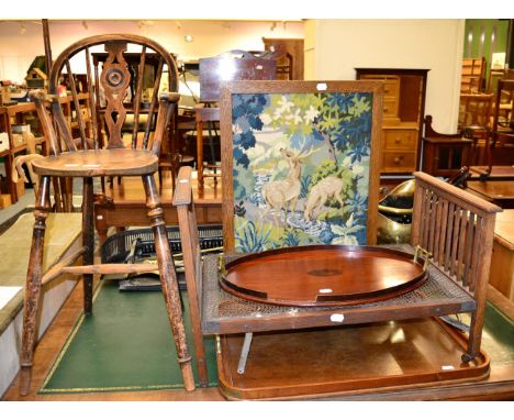 A small group including a childs elm Windsor high chair; oak bed tray; further two trays; an oak framed firescreen; oak coal 