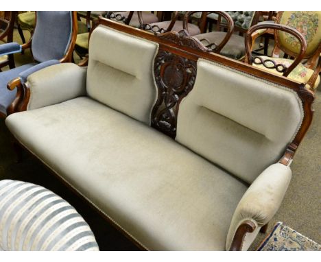 Victorian part upholstered open armchair; together with a carved mahogany framed double sofa 