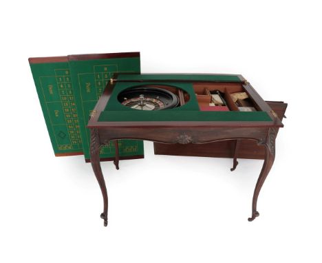 An Edwardian Mahogany Metamorphic Games Table, the moulded rectangular top lifting off to reveal a baize-lined card surface, 