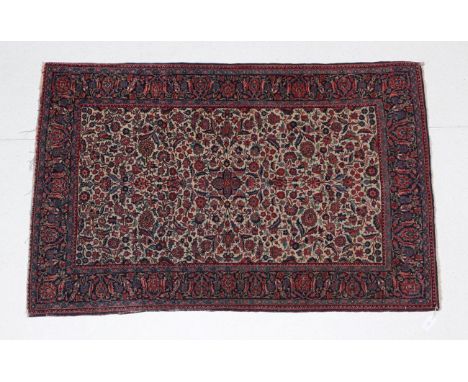 Kasvin Rug North West Iran, circa 1940 The cream field richly decorated with palmettes flowering and flowing vines enclosed b