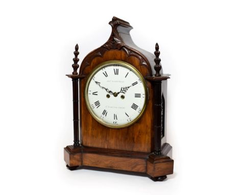 A Gothic Revival Striking Table Clock, circa 1850, arched pediment, carved finials, side sound frets, 9-1/2-inch enamel dial 