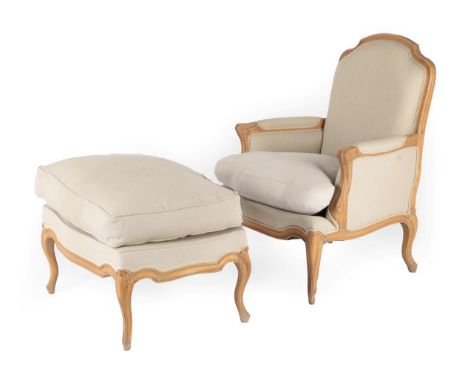 A Louis XV Style Oak Framed Armchair, modern, covered in light beige fabric, with a moulded frame, padded back support, arms 