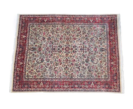 Good Saroukh Carpet West Iran, circa 1960 The ivory field with scrolling floral vines and twin urns issuing flowers enclosed 