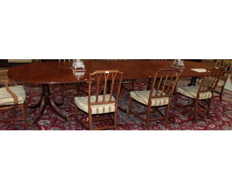 A George III Style Mahogany Four-Pillar Dining Table, comprising two D end sections and two rectangular middle sections, on g