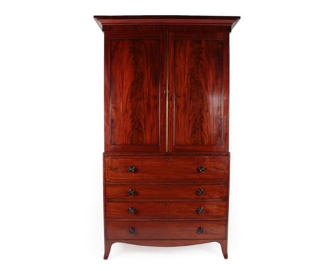 A Regency Mahogany and Ebony Strung Secretaire Linen Press, early 19th century, the bold cornice above two moulded cupboard d