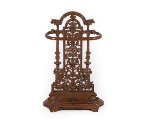 A Victorian Cast Iron Coalbrookdale Style Stick Stand, late 19th century, repainted brown, with foliate pierced back support,