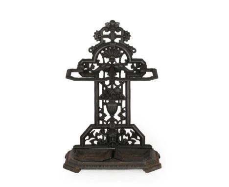 A Cast Metal Coalbrookdale Style Two-Division Stick Stand, the back support decorated with an urn and shells supporting two d