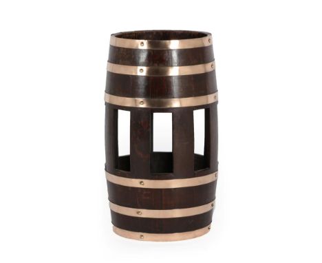 An Oak and Copper Bound Stick Stand, as a barrel, of staved construction with six riveted bindings above a pierced body, 30cm
