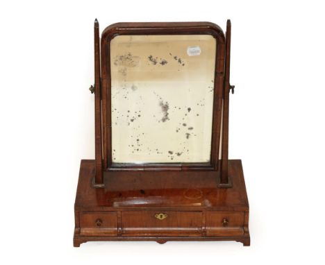 A George II Walnut and Feather-Banded Toilet Mirror, 2nd quarter 18th century, the mercury bevelled glass plate within a moul
