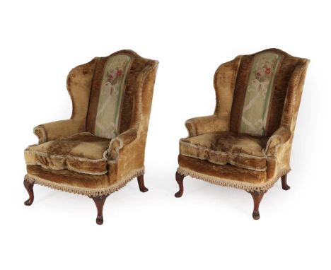 A Pair of George III Style Wing-Back Armchairs, early 20th century, covered in light brown velvet with green floral back supp