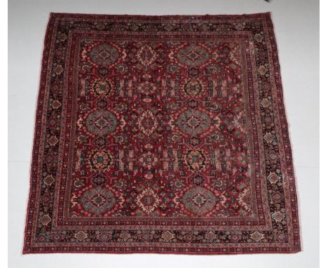 Mahal Carpet of unusual size West Iran, circa 1940 The brick red field with an all over design of large flower heads enclosed