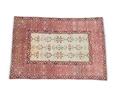 Mughal Design Carpet Central/North India, modern The cream field of semi naturalistic flowering plants enclosed by wide coral