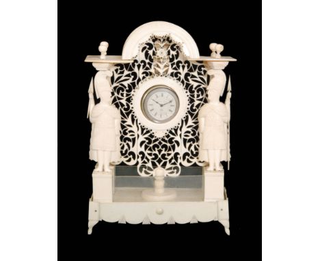 A 19th Century carved bone watch stand, possibly a prisoner of war example, with a pierced fret-cut frame flanked by two carv