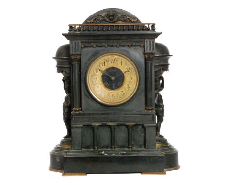 An early 20th Century large black slate mantle clock of classical form with eight day striking movement flanked by two robed 