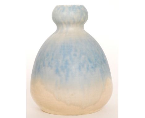 A Ruskin Pottery crystalline glaze vase of gourd form with a small ovoid neck, the whole glazed in a tonal light blue to crea