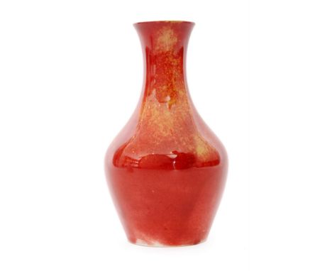 A 1910s William Moorcroft 'lost shape 372' vase of mallet form glazed in a ruby and ochre lustre, impressed mark, retains H.M