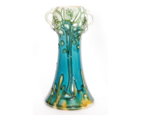 An early 20th Century Minton Secessionist vase No.41 decorated with tubelined flowers and foliage in white, tones of blue and