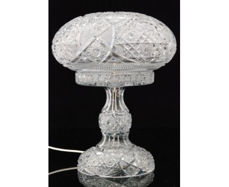 A 20th Century American brilliant cut clear crystal glass lamp in the manner of Meriden, the domed foot rising to a swollen s