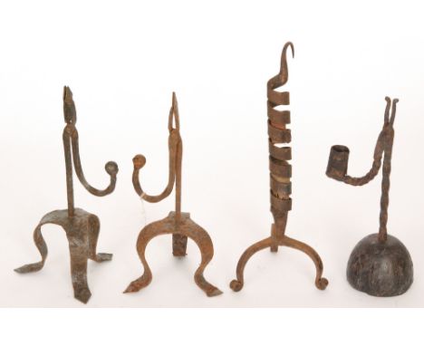 AMENDED DESCRIPTION - A pair of 18th Century style iron rush light holders each on tripod legs, another on a domed wooden bas