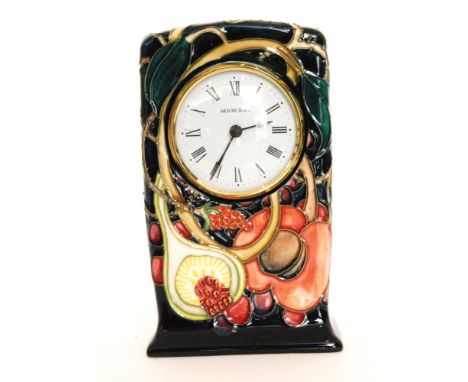 A Moorcroft Pottery mantel clock decorated in the Queens Choice pattern designed by Emma Bossons, printed and painted marks, 