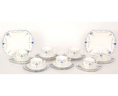 A set of six 1930s Shelley Art Deco Queen Anne shape trios decorated in the Blue Iris 15561 pattern comprising six teacups, s