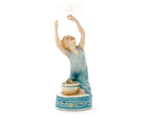 A 1930s Royal Worcester figurine by Freda Doughty entitled Bubbles, modelled as a young girl dressed in a blue nightdress hol