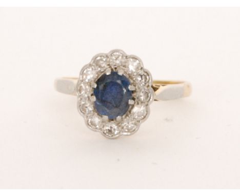 PLEASE NOTE THE PHOTOGRAPH WAS PREVIOUSLY INCORRECT - THE LOT IS SOLD AS NOW PHOTOGRAPHEDAn 18ct sapphire and diamond cluster