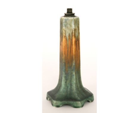 A Ruskin Pottery lamp base of hexagonal form glazed in a mottled blue to orange to green, impressed mark, retains original pa