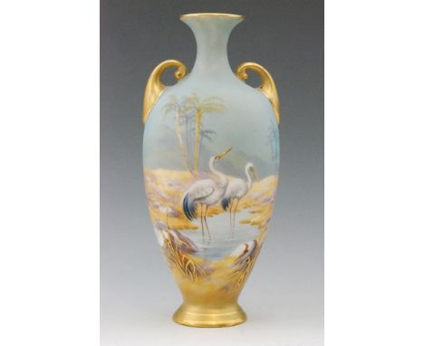 A Royal Worcester twin handled shape H287 vase decorated by George Johnson with hand painted storks watering in a palm tree d