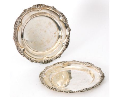 A pair of hallmarked silver plates of circular outline with gadroon border, total weight 49oz, diameter 26cm, London 1842, R 
