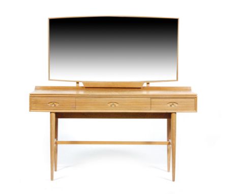 A post war teak 'Hamilton' dressing table, designed by Robert Heritage for Archie Shine, with a mirror panel above three ribb