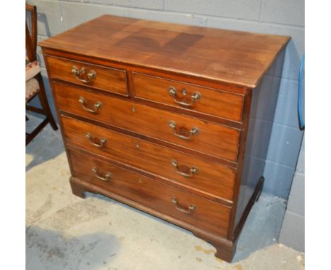A George III mahogany chest of two short over three long cock-beaded drawers, with brass loop drop handles on bracket feet, w