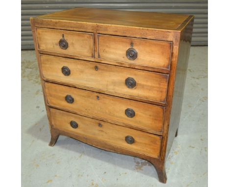 A George IV mahogany chest of two short over three long drawers, the top with a cross-banded border above the cock-beaded dra