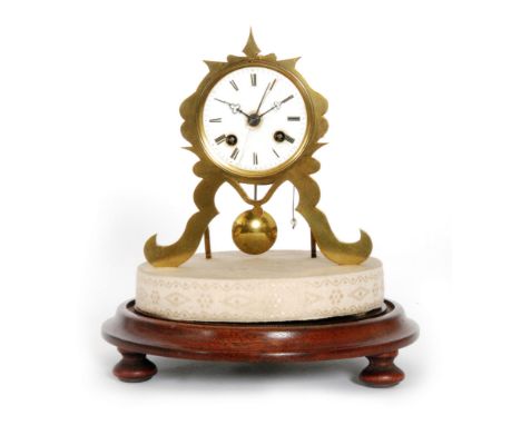 A 19th Century brass mantle clock with eight day movement striking on a bell in a glass dome, on turned circular mahogany bas