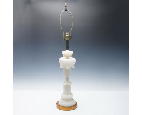 An elegant vintage table lamp crafted from carved alabaster, featuring a smooth, translucent white stone base with subtle dar