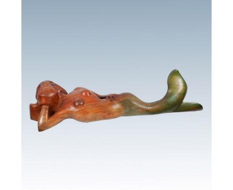 This striking hand-carved wooden mermaid sculpture showcases exquisite craftsmanship, capturing the form of a reclining merma