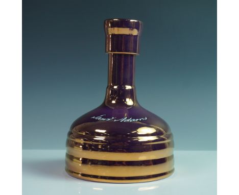 A sealed bottle of Sam Adams Utopias 2023, a limited-edition biennial release from the Boston Beer Company. The bottle contai