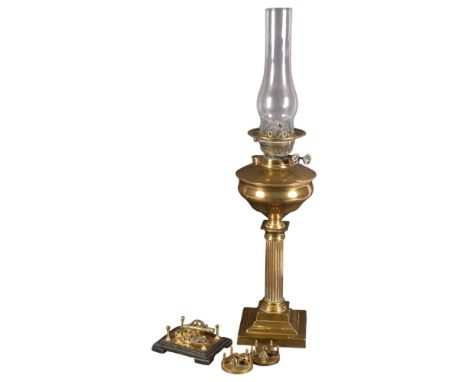 A brass Duplex oil lamp with Corinthian column and chimney, H64cm, a miniature brass table cannon on wooden stand, 13c across