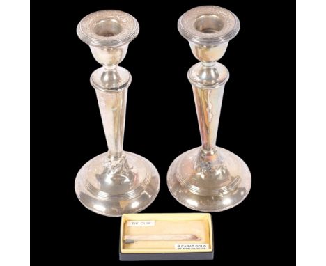 A pair of George V silver table candlesticks, indistinct maker, London 1922, 18cm (A/F), and a 9ct gold on sterling silver ti