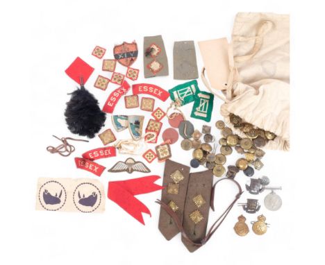 A collection of Second World War cloth badges, cap badges, epaulettes, dog tags named to LS Denman P/187098CE, brass buttons,